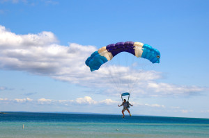 Man parachuting to shore